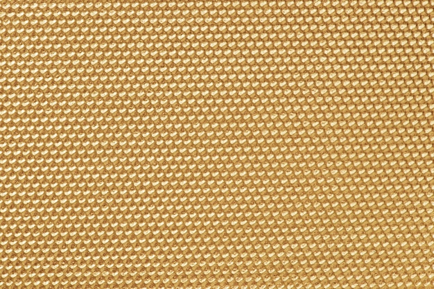 Papel pintado con patrón de panal de color dorado