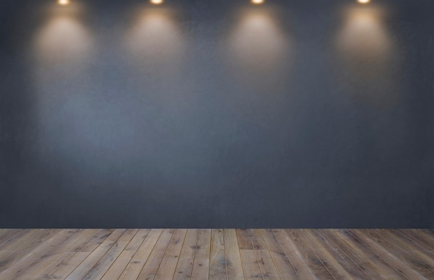 Pared gris oscuro con una fila de focos en una habitación vacía