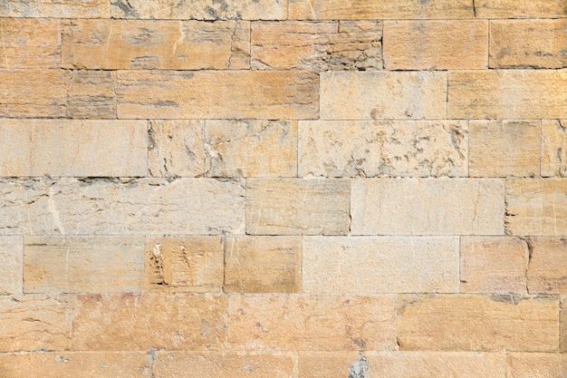 Foto gratuita pared hecha de ladrillos de diferentes tamaños