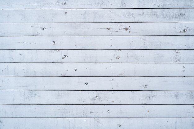 Pared de madera pintada de blanco para el fondo y la textura.