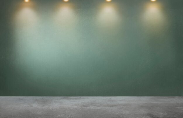 Pared verde con una fila de focos en una habitación vacía