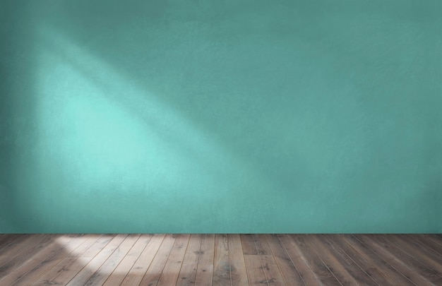 Pared verde en una habitación vacía con piso de madera.