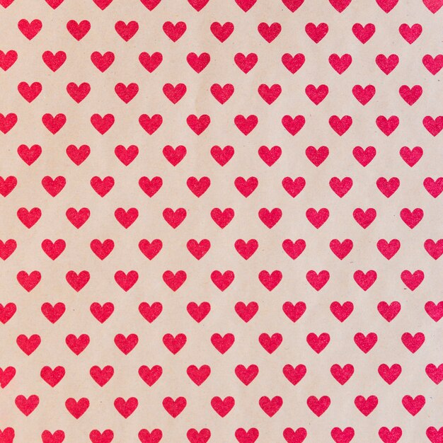 Patrón sin fisuras con corazones rojos