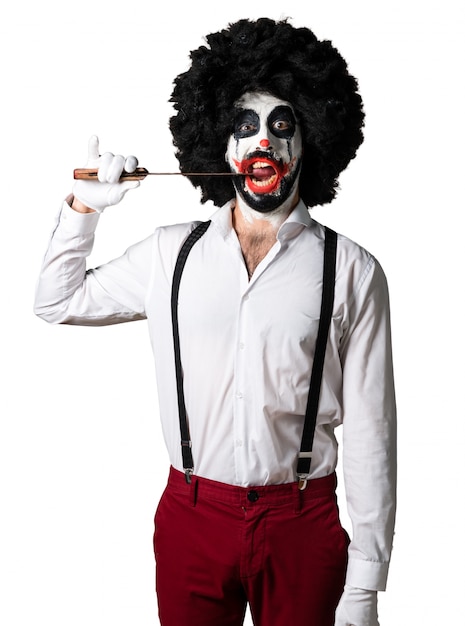 Foto gratuita payaso asesino con cuchillo