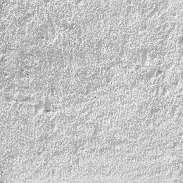Porosa superficie de tiza de la pared blanca