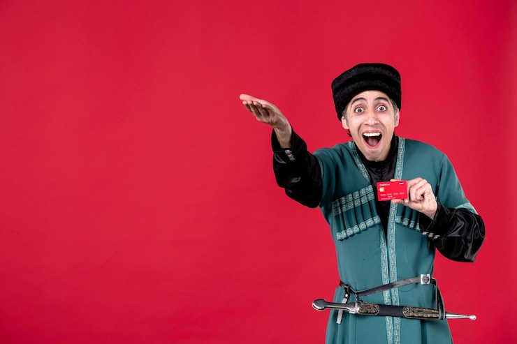 Photo Gratis portrait of azeri man in traditional costume holding credit card studio shot red novruz money ethnic