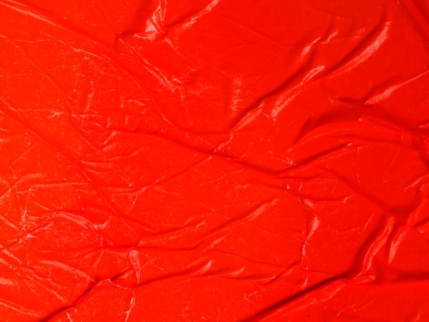 Primer plano arrugado fondo de papel rojo