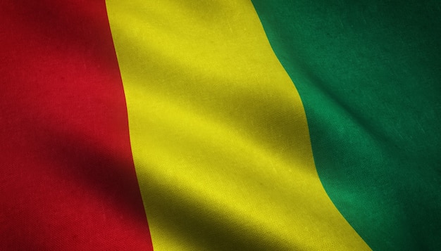 Primer plano de la bandera ondeante de Guinea con texturas interesantes