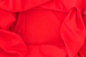 Foto gratuita primer plano de fondo textil rojo tela