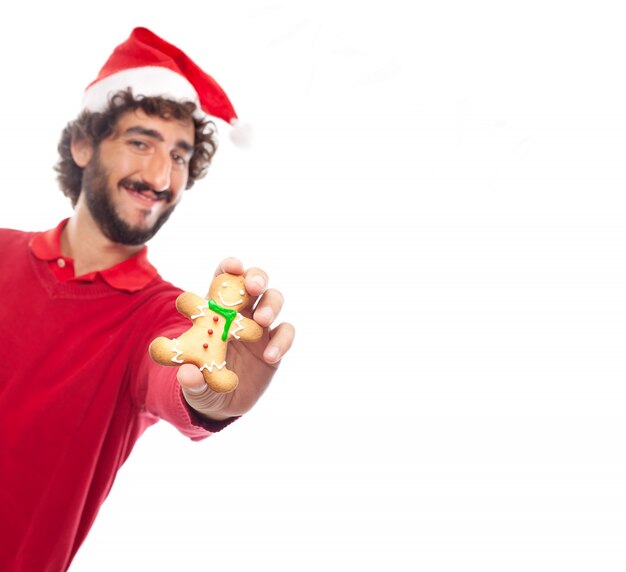 Primer plano de mano con una galleta de jengibre