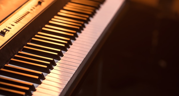 Primer plano de las teclas del piano, sobre un fondo de color hermoso, el concepto de instrumentos musicales