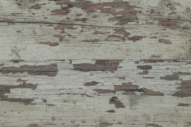 Primer plano de una vieja superficie de madera dañada