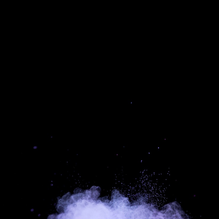 Foto gratuito ráfaga de polvo de maquillaje vibrante sobre fondo oscuro