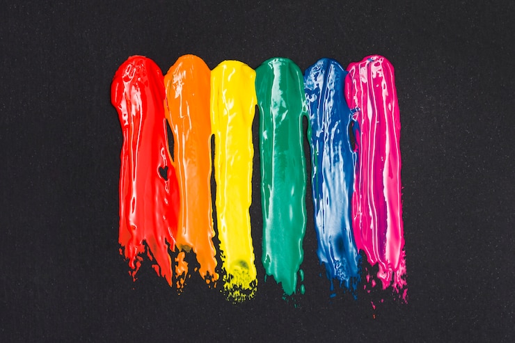 Foto gratuito rayas multicolores de pintura al óleo sobre fondo negro