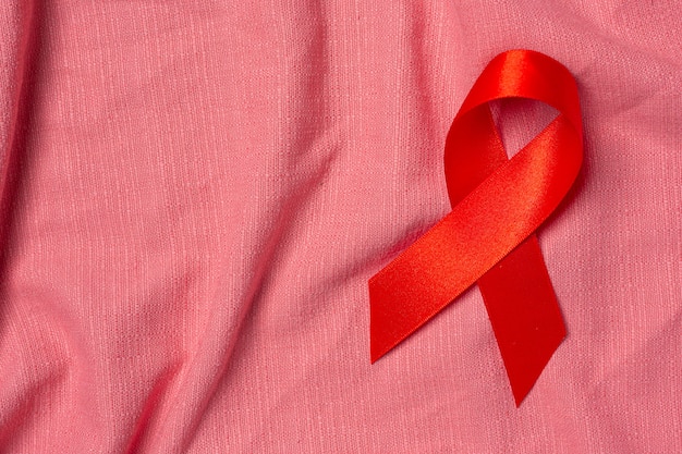 Red Ribbon Concepto de concienciación sobre el VIH Día Mundial del SIDA y Día Mundial de la Salud Sexual.