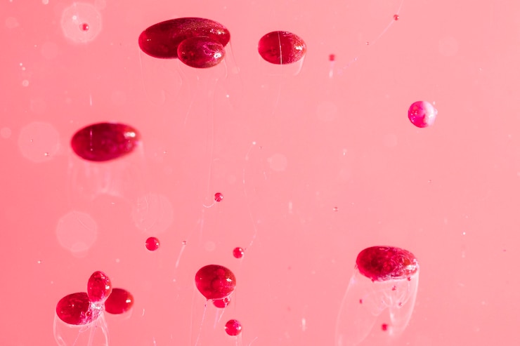 Foto gratuito resumen de piedras de aceite en la superficie de color rosa