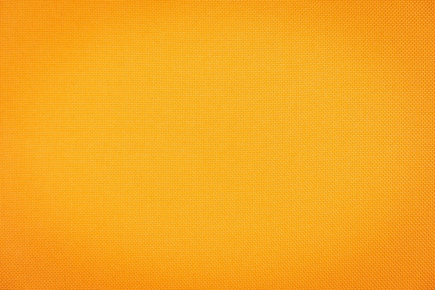 Resumen superficie y texturado de texturas de tela de algodón naranja.