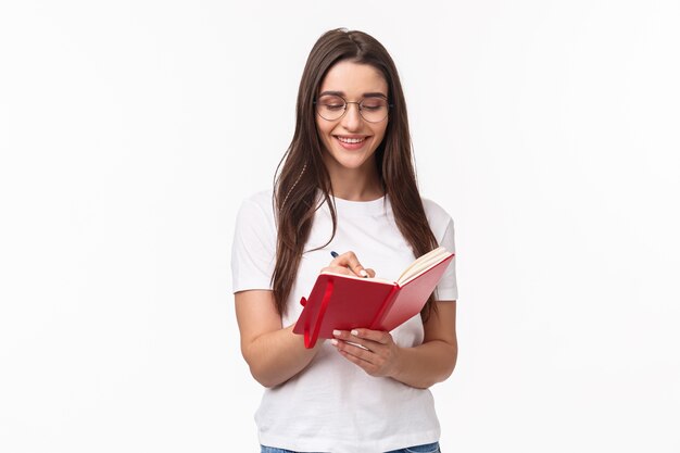 retrato, expresivo, mujer joven, tenencia, cuaderno