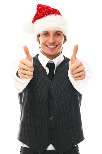 Foto gratuita retrato de hombre joven feliz con gorro de papá noel