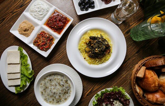 Sabzi pilaf and other food on the table top view