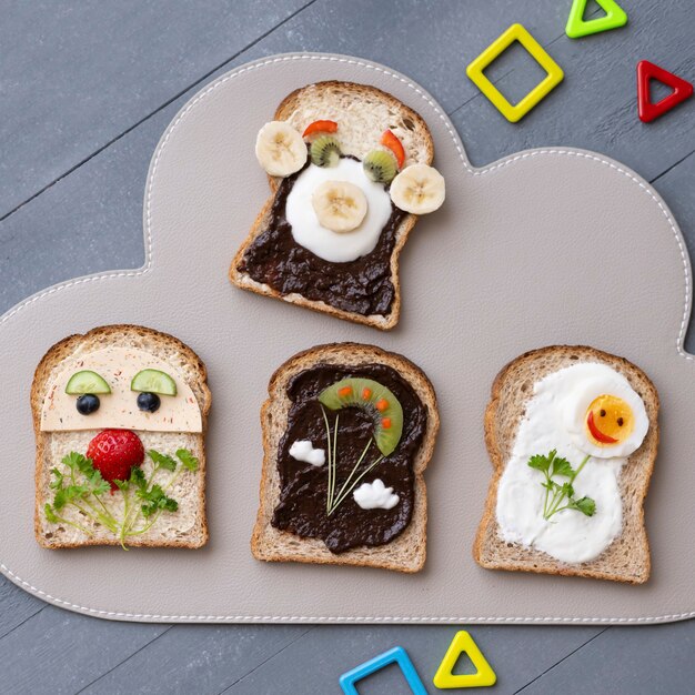 Sándwiches de arte de comida para niños, con caras divertidas y flores.