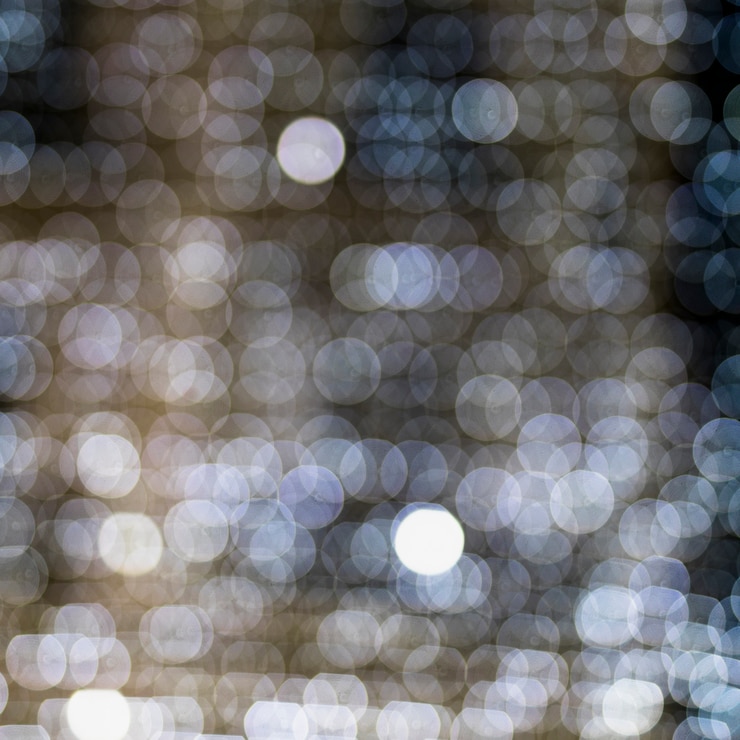 Photo Gratis seamless pattern of white glowing illuminated bokeh background
