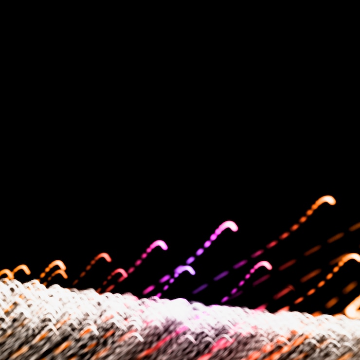 Foto gratuito senderos de luz de colores sobre fondo negro