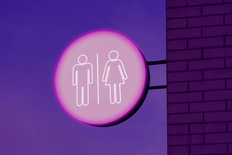 Foto gratuito signo de baño de luz de neón por la noche