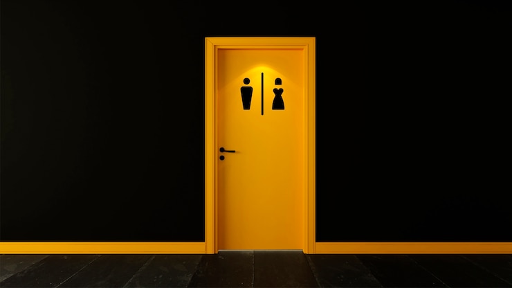 Foto gratuito signo de baño en puerta amarilla