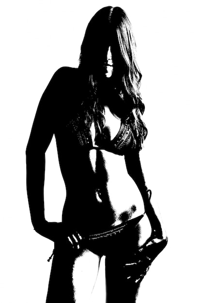 Silueta de la joven y bella mujer desnuda. Aislado en blanco.