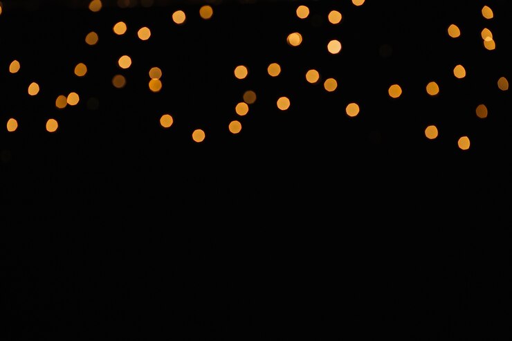 Photo Gratis small spots of light on black