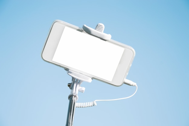 Smartphone en selfie stick closeup