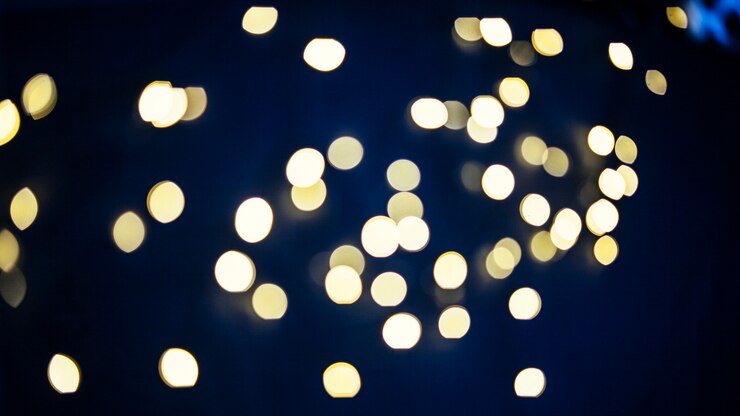 Photo Gratis spots of light on dark blue background