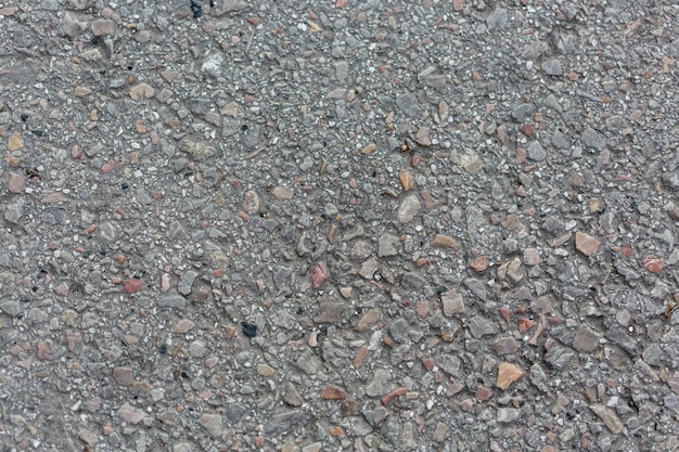 Foto gratuita superficie de cemento con rocas y guijarros