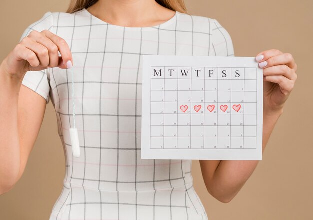 Tampón y calendario medio menstrual