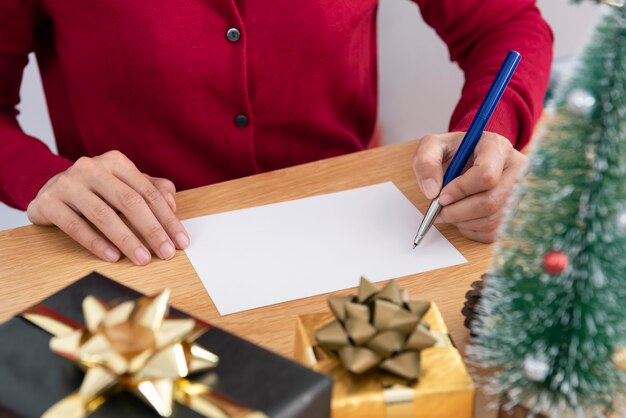 Tarjeta de felicitación de maqueta de escritura a mano para feliz Navidad y próspero año nuevo