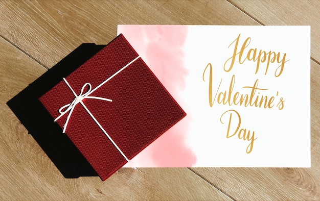 Tarjeta de San Valentín feliz con caja de regalo