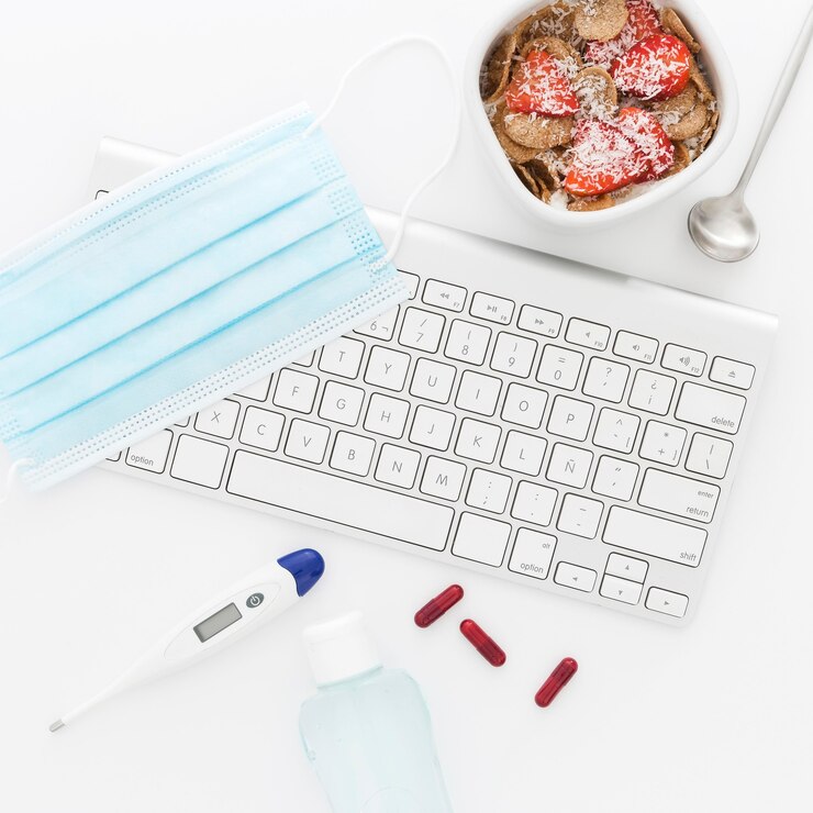 Foto gratuito tazón con frutas para el desayuno y herramientas médicas en la oficina