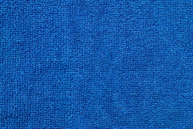 Telón de fondo de textura de tela de tela textil azul suave.