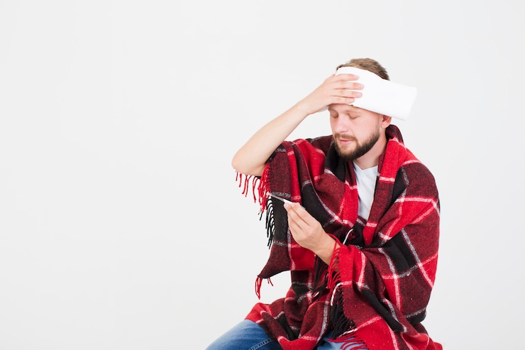 Foto gratuito temperatura de medición del hombre