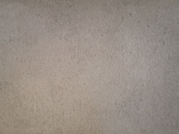 Textura abstracta de la pared del cemento del grunge beige.
