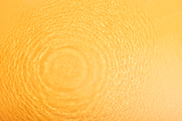 Foto gratuita textura de agua de vista superior en naranja