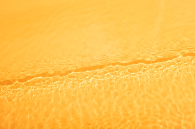 Foto gratuita textura de agua de vista superior en naranja