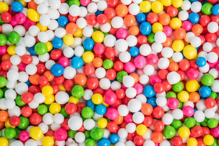 Foto gratuito textura de fondo colorido con dulces de azúcar espolvorea punto