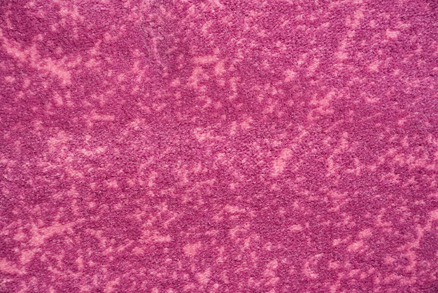 Textura de la foto macro de la alfombra de felpa de felpa magenta de pelo corto suave