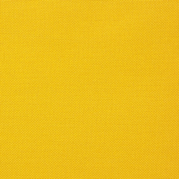 Foto gratuita textura de lienzo amarillo para el fondo