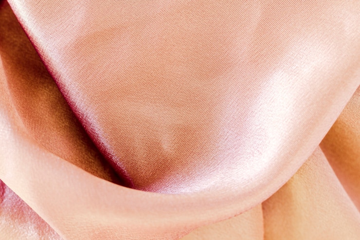 Foto gratuito textura de material de tela rosa con espacio de copia