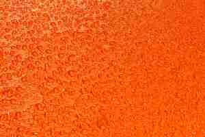 Foto gratuita textura naranja con gotas de agua