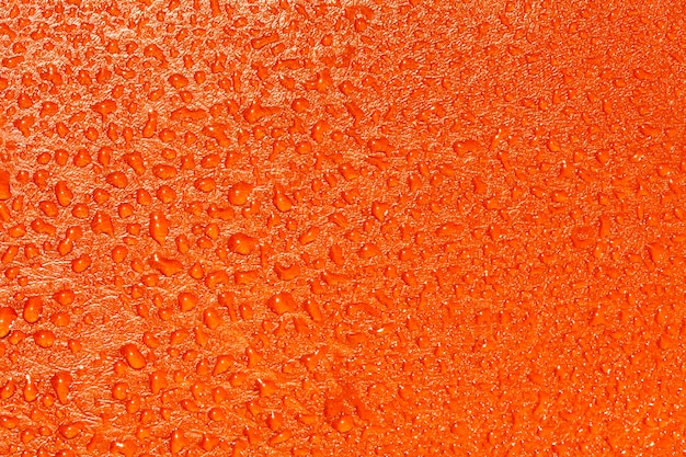 Textura naranja con gotas de agua