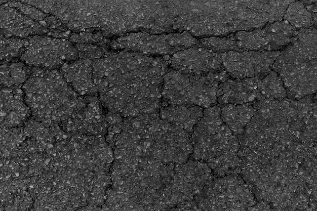 Foto gratuita textura o fondo de asfalto roto negro